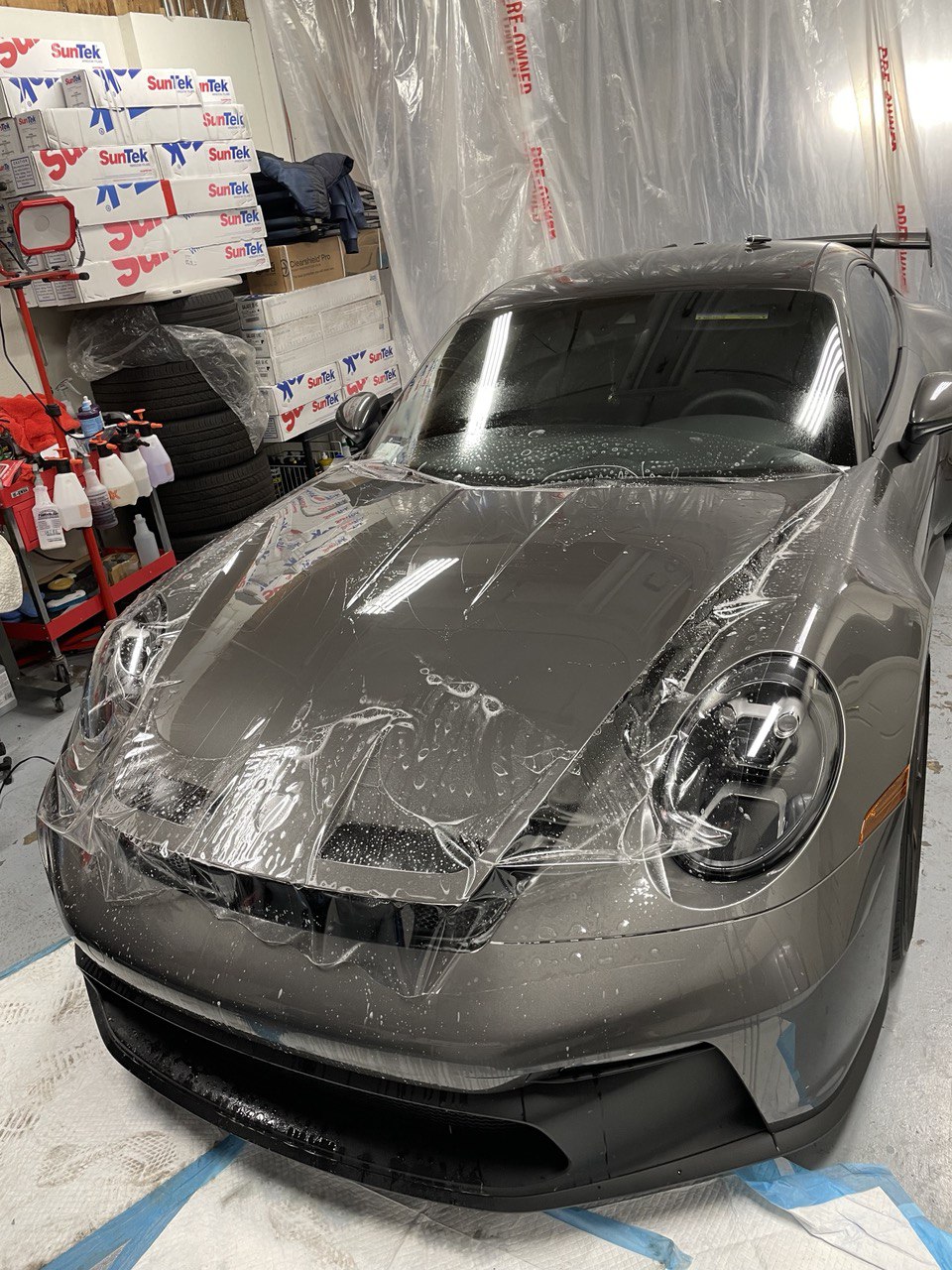 Grey Porsche 911 getting SunTek paint protection film applied in Gold River, CA.