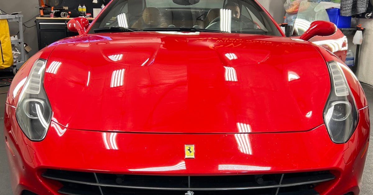 Red Ferrari in a professional window tinting shop in Gold River, CA.